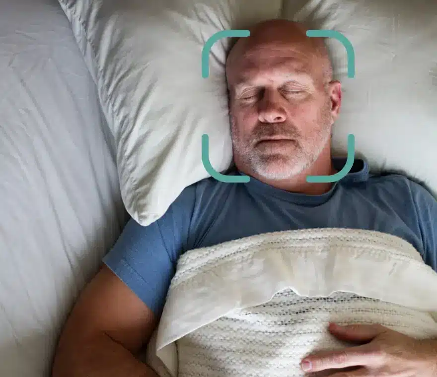 A man is asleep with a target image surrounding his face. MaskFit AR is the very best way to find your perfect CPAP mask fit.